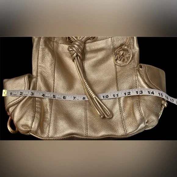 Michael Kors Metallic Gold Leather Drawstring Shoulder Bag. - Picture 9 of 16